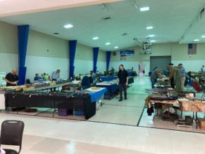 Indoor tables displaying items from Military Collectors