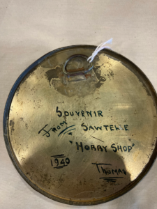 back side of a painted coin bank