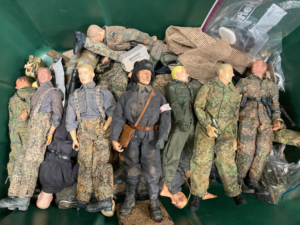 Complete military action figures, many are missing their arms and equipment